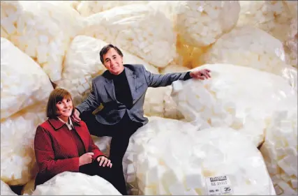  ?? PETER POWER/TORONTO STAR ?? Left, Robin Jowett, who runs the financial side, and husband Craig, the inventor, with fresh foam blocks destined for a few decades of work in Biofilter septic tank systems. The system is designed to make tank effluent cleaner and so more safely...