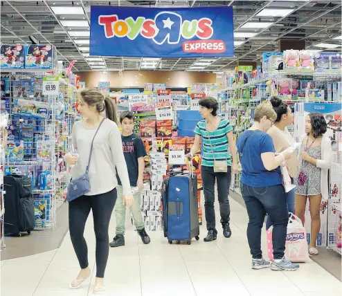  ?? ALAN DIAZ / THE ASSOCIATED PRESS FILES ?? Black Friday shoppers in a Toys “R” Us store in Miami.The pioneering big-box toy retailer, announced Monday it has filed for Chapter 11 bankruptcy protection in the U. S. while continuing with normal business operations.