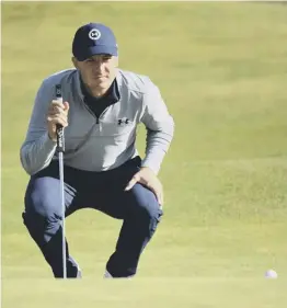  ??  ?? American Jordan Spieth lines up a putt on the 12th green