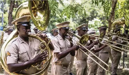  ?? VALERIE BAERISWYL AFP via Getty Images ?? A military band honors late Haitian President Jovenel Moïse in Port-au-Prince, Haiti, on July 20.