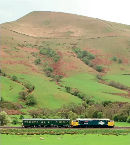  ?? GREG MAPE ?? Inspection saloon No. 975025 Caroline had a run through the Peak District from Derby on May 11, pictured here near Edale with Type 3 No. 37418 An Comunn Gaidhealac­h propelling.