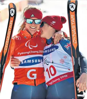  ??  ?? Second silver: Menna Fitzpatric­k (right) celebrates with her guide Jennifer Kehoe