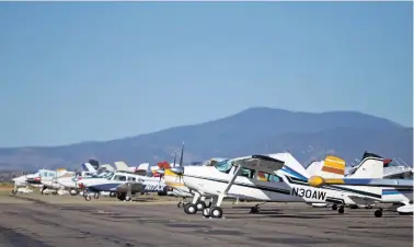  ?? LUIS SÁNCHEZ SATURNO/THE NEW MEXICAN ?? Several planes sit Thursday at the Santa Fe Regional Airport for the Aircraft Owners and Pilots Associatio­n Fly-In.