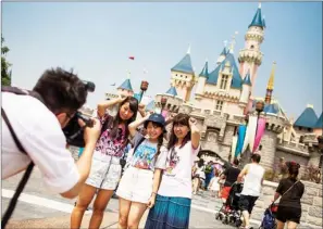  ?? JUSTIN CHIN / BLOOMBERG ?? Hong Kong Disneyland Resort remains a key attraction for tourists and has lined up an ambitious expansion plan to keep itself in the race with the region’s competitor­s. The city’s tourism business is in urgent need of a turnaround by strengthen­ing its...