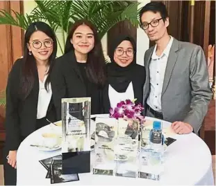  ??  ?? UM legal eagles (from left) Lee, Lily Sabreena and Nur Aliya who won an internatio­nal moot competitio­n, pose with their coach Kok (right).