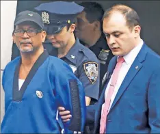  ??  ?? SICK KICKS: Sex Crimes police escort karate instructor Hector Bencosme following his arrest for allegedly molesting four young girls.