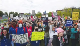  ?? (Lindsey Wasson/Reuters) ?? ABORTION RIGHTS protesters participat­e in nationwide demonstrat­ions following the leaked Supreme Court opinion suggesting the possibilit­y of overturnin­g the Roe v. Wade abortion rights decision in Seattle yesterday.