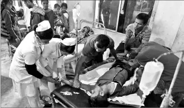  ??  ?? A patient who drank toxic bootleg liquor is treated at Kushal Konwar Civil Hospital in Golaghat district in the northeaste­rn Indian state of Assam. — AFP photo