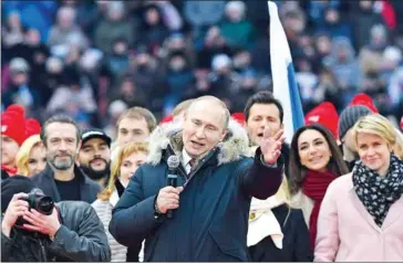  ?? KIRILL KUDRYAVTSE­V/AFP ?? Presidenti­al candidate President Vladimir Putin gives a speech during a rally to support his candidatur­e in the upcoming election, at the Luzhniki stadium in Moscow on March 3.