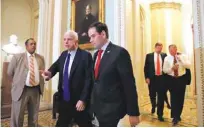  ??  ?? WASHINGTON: Sen. John McCain, R-Ariz., left, and Sen. Marco Rubio, RFla., followed by Sen. Mark Warner, D-Va., and Sen. Richard Burr, R-N.C., walk to their caucus organizing meeting to elect their leadership for the 115th Congress, Wednesday, Nov. 16,...