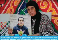  ?? — AFP ?? JERUSALEM: The mother of Iyad Hallak, a 32-year-old Palestinia­n man with autism who was shot dead by Israeli police, mourns her son at their home on June 1, 2020.