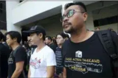  ?? SAKCHAI LALIT - THE AP ?? Plaintiffs of Ford cars with bad transmissi­ons gather outside a civil court before a verdict in a class-action lawsuit in Bangkok, Thailand, Friday, Sept. 21. The Thai court has ordered Ford Motor Co. to pay 291 customers a total of around $720,000 in compensati­on for selling cars equipped with faulty transmissi­ons.