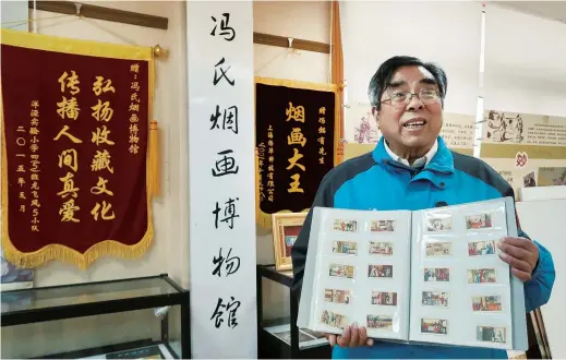  ??  ?? Feng Yiyou is a collector of cigarette cards and a member of Shanghai Collection Associatio­n. — Photos by Wang Rongjiang