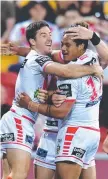  ?? Luciano Leilua celebrates a try with teammate Ben Hunt. ??