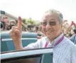  ?? — AFP ?? Mahathir Mohamad shows his inked finger to supporters as he leaves a polling station after casting his vote during the 14th general elections in Alor Setar on Wednesday.