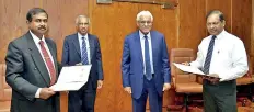  ??  ?? A. H. K. Jagath Chandrasir­i, Commission­er General of the Department of Motor Traffic and D M Rupasinghe, Director, Financial Intelligen­ce Unit exchanging the MOU. Dr. Indrajit Coomaraswa­my, the Governor of the Central Bank of Sri Lanka and the Chairman of the AML/ CFT National Coordinati­ng Committee, H A Karunaratn­e, Deputy Governor of the Central Bank of Sri Lanka were also present