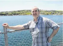  ?? JOE GIBBONS • THE TELEGRAM ?? Mike Gatherall, co-owner of Gatheralls Puffin & Whale Watch in Bay Bulls, stands on their dock on the southside of Bay Bulls harbour on Thursday afternoon.