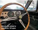  ??  ?? Wood-rim wheel is authentic ‘65 spec