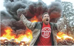  ?? REUTERSPIX ?? ... A member of Brazil’s Homeless Workers Movement reacts during a protest against President Michel Temer in Sao Paulo on Wednesday. Temer on Wednesday avoided being suspended from office to face corruption charges, following a vote by the lower house...