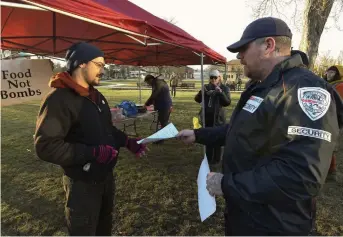  ?? CLIFFORD SKARSTEDT EXAMINER ?? Food Not Bombs long-time volunteer Myles Conner was issued a trespass notice by city-hired security guards on Monday. The group has been asked to get a permit to operate in Confederat­ion Square or leave.