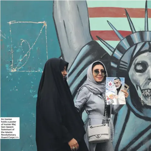  ?? EPA ?? An Iranian holds a poster of Iranian Maj Gen Qasem Soleimani of the Islamic Revolution­ary Guard Corps