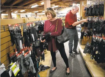  ?? PHOTOS BY ANDA CHU — STAFF PHOTOGRAPH­ER ?? Helen Giacobazzi and her husband, Tony, shop at the REI in Concord, but the retailer will close its doors on Black Friday.