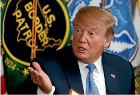  ?? AP ?? President Donald Trump participat­es ina roundtable on immigratio­n and border security at the US Border Patrol Calexico Station in Calexico, California, earlier this month.