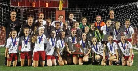  ?? CHRIS DEANTONIO - FOR DIGITAL FIRST MEDIA ?? The Fleetwood girls soccer team poses with the BCIAA championsh­ip trophy after winning the title with a victory over Gov. Mifflin on Oct. 20.