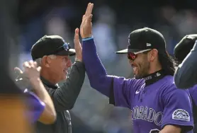  ?? ?? Rockies manager Bud Black is congratula­ted by Connor Joe after the 1,000th win of his managerial career Sunday.