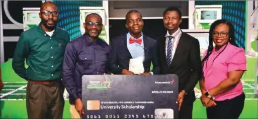  ?? ?? L-R: Tomijogun Ogunlesi, Divisional Head, Brands and Communicat­ions, Interswitc­h; Vincent Ogbunude, Managing Director, Interswitc­h Cards and Tokens (Verve); Abraham Daramola, Winner; Balogun Adedeji, Abraham’s teacher and Yemisi Owonubi, Head, Communicat­ions and CSR, Interswitc­h at the grand finale of the Interswitc­hSPAK 5.0 National Science Competitio­n which held recently in Lagos