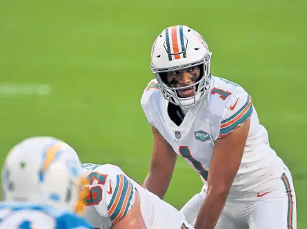  ?? Mark Brown, Getty Images ?? Miami Dolphins rookie quarterbac­k Tua Tagovailoa is now 3- 0 in his first three NFL starts, including Sunday’s 29- 21 victory over the Los Angeles Chargers in Miami.