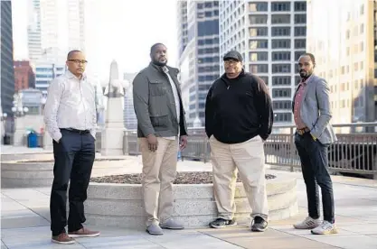  ?? E. JASON WAMBSGANS/CHICAGO TRIBUNE ?? Lincoln Park High School has reinstated Dean John Johnson, from left, reinstated assistant coach Donovan Robinson, partially reinstated girls basketball coach Larry Washington and fired varsity boys basketball coach Pat Gordon.