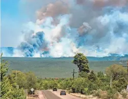  ?? EDDIE MOORE/THE ALBUQUERQU­E JOURNAL VIA AP, FILE ?? The Hermits Peak-Calf Canyon Fire burns near Pecos, N.M., last year.