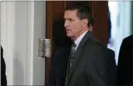  ?? THE ASSOCIATED PRESS ?? Mike Flynn arrives for a news conference Feb. 13 in the East Room of the White House in Washington.