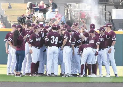  ?? Cleveland, SDN) (Photo by Jason ?? The Mississipp­i State baseball team huddles prior to Friday’s Southeaste­rn Conference opener with Arkansas.