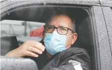  ?? POSTMEDIA NEWS ?? Unifor Local 444 president Dave Cassidy monitors the vehicle shipping exit at Windsor Assembly Plant Friday.