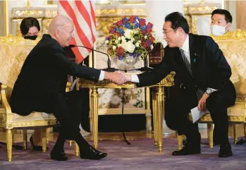  ?? EVAN VUCCI/AP ?? Japanese Prime Minister Fumio Kishida, right, hosts President Joe Biden on Monday at Akasaka Palace in Tokyo.