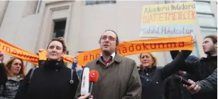  ?? (Osman Orsal/Reuters) ?? TURKISH ACADEMIC Olcay Kunay speaks in front of the Justice Palace during first of a series of trials against a total of some 150 academics from public and private universiti­es accused of spreading terrorist propaganda, in Istanbul last week.