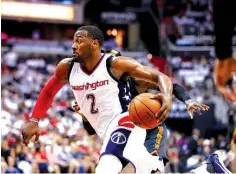  ?? Associated Press ?? Washington Wizards guard John Wall drives toward the basket April 16 during the first half against the Atlanta Hawks in Washington.