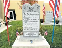  ?? REBECCA MOSS/NEW MEXICAN FILE PHOTO ?? The Ten Commandmen­ts monument at Bloomfield City Hall has been the center of controvers­y in this city for several years. Two federal courts have maintained it violates the First Amendment and the town must take it down.