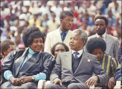  ?? AP ?? Photo taken in 1990 shows Winnie Mandela with her former husband Nelson Mandela at a rally in Soweto, South Africa shortly after his release from 27 years in prison.