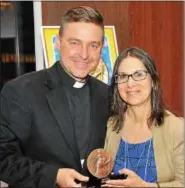  ??  ?? Ann Burg with Father Jonathan Morris.