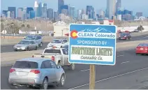  ??  ?? A Clean Colorado sign on Sixth Avenue west of Sheridan Boulevard shows a sponsorshi­p of that stretch of highway by Northern Lights Cannabis Co.