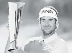  ?? - AFP photo ?? Bubba Watson poses with the trophy after winning the Genesis Open at Riviera Country Club in Pacific Palisades, California.