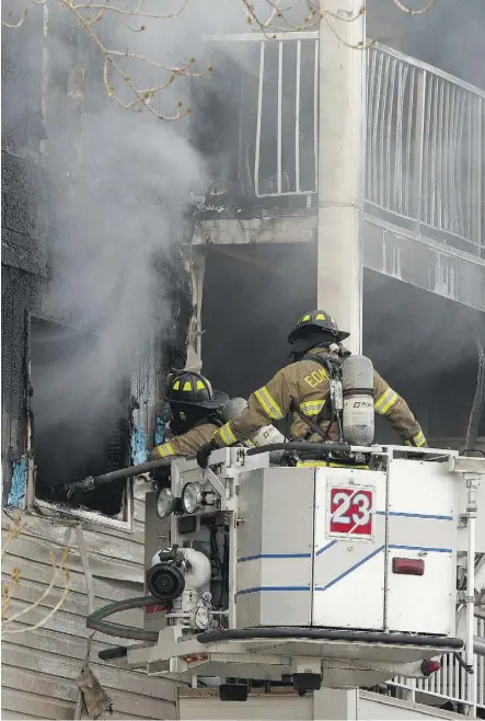  ?? IAN KUCERAK ?? Firefighte­rs battle a blaze at Westridge Estates in the city’s west end on Thursday. Eight trucks were called to the complex after an alarm went off around 8 a.m. The blaze was under control by 11 a.m.