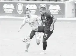  ?? GERALD LEONG/ORLANDO SENTINEL ?? Orlando City’s Júnior Urso controls the ball during the Lions’ win over the New York Red Bulls on Oct. 3 at Exploria Stadium.