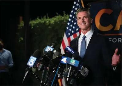  ?? XAVIER MASCARENAS
THE SACRAMENTO BEE ?? Gavin Newsom speaks to reporters after recall election results in 2021 showed he would likely remain in office. In 2022 election, in almost every county in the state, Newsom lost a small percentage of the votes he won when he first ran.