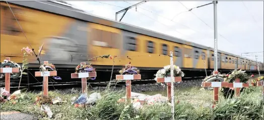  ?? PICTURE: BRENTON GEACH ?? Ten crosses erected at the level crossing in Blackheath, Cape Town, in memory of the children who died when the minibus they were in was hit by a train.