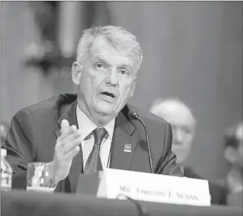  ?? Alex Edelman TNS ?? CEO Timothy Sloan, a longtime Wells Fargo veteran, is keeping his job, as are several board members.