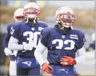  ?? Steven Senne / Associated Press ?? Patriots free safety Devin McCourty, right, and his brother cornerback Jason McCourty warm up during practice Wednesday in Foxborough, Mass.